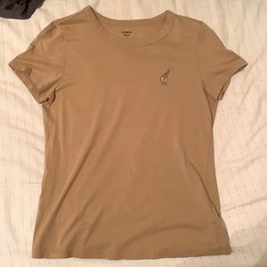 tan tee with embroidered giraffe.
